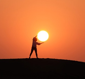 Person Holding the Sun